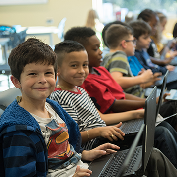 Group of students using laptops